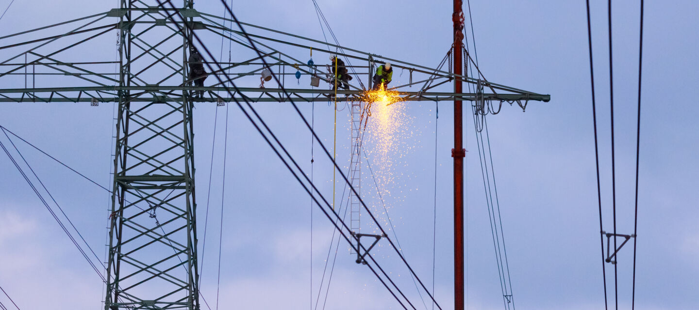 Cteam construction team working on a high-voltage pylon, ensuring reliable power infrastructure. Cteam construction team working on a high-voltage pylon, ensuring reliable power infrastructure.