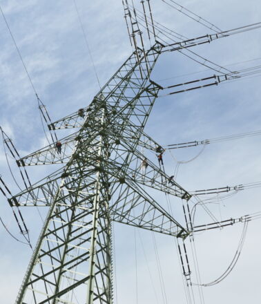 Cteam technicians perform construction and maintenance on a high-voltage power transmission tower. Cteam technicians perform construction and maintenance on a high-voltage power transmission tower.