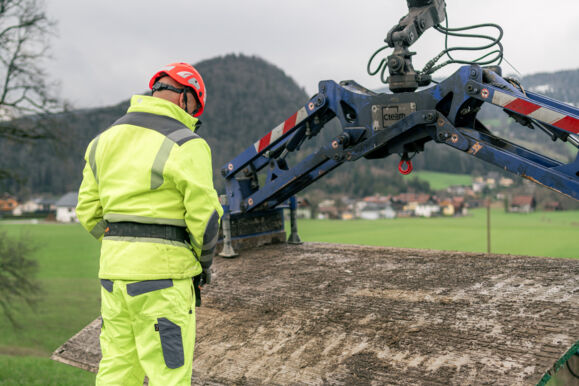 Cteam expert using crane for heavy lifting in construction logistics. Cteam expert using crane for heavy lifting in construction logistics.