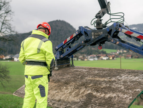 Cteam expert using crane for heavy lifting in construction logistics. Cteam expert using crane for heavy lifting in construction logistics.