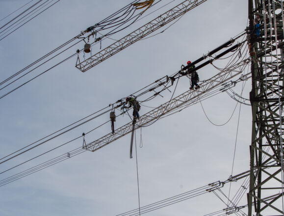 Cteam workers conducting overhead line construction and maintenance on high voltage infrastructure. Cteam workers conducting overhead line construction and maintenance on high voltage infrastructure.